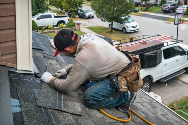 Professional Roofing technician working in North Waltham, MA